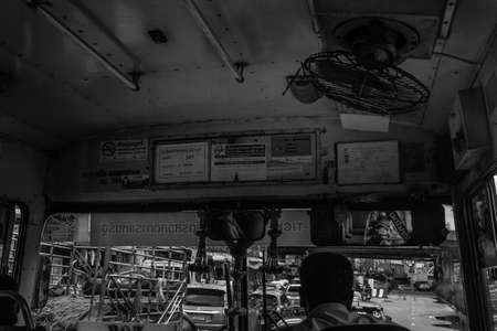 bangkok,Thailand - jun 29, 2019 : The bus driver in a old bus on the roads of bangkok, Black and white.のeditorial素材