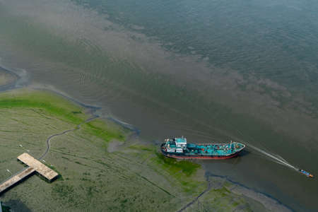 The boat docked in Chao Phraya River in the afternoon, Top view.の写真素材