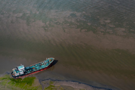 The boat docked in Chao Phraya River in the afternoon, Top view.