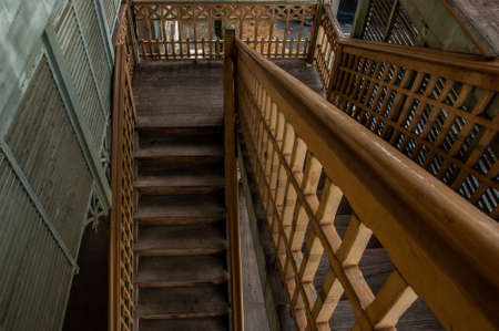 Nonthaburi, Thailand - JUL 21,2019 : The stairs to the 2nd floor of old city hall, European style building. The vintage white wooden house was left to deteriorate over time, Once be Former city hall. Established on 1548, is tranformed to be the museum of のeditorial素材