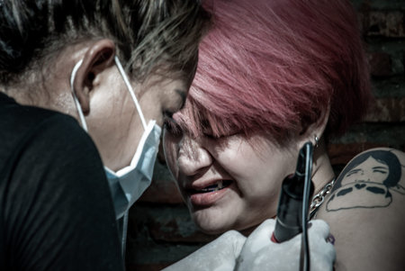 Bangkok, Thailand - 25 Aug 2019 : Tattooist making by professional artist is tattooing body sexy...