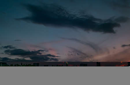Natural Sunset in evening downtown silhouette at bangkok. Bright Dramatic Sky And Dark Ground. city Landscape Under Scenic Colorful Sky At Sunset. Sun Over Skyline, Horizon. Light blue background. copy space.の写真素材