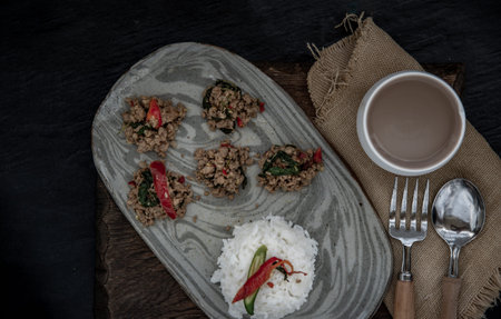 Stir fried Thai basil with minced pork and basil served with steamed rice. Popular traditional food...