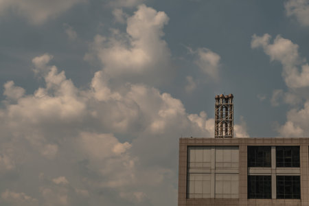 Bangkok, thailand -24 Oct, 2019 : Four chimneys on the flat roof off a big building in the city, copy space.のeditorial素材