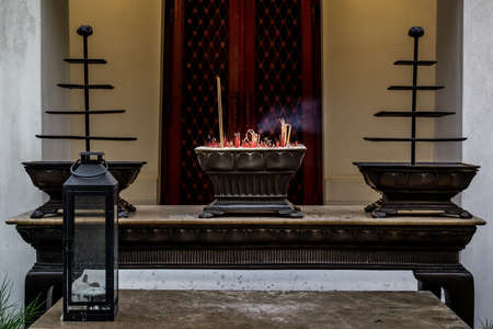 Incense burning in incense pot for holy worship The Dhevasathan (Brahmin Shrines) at The Giant Swing (Sao Chingcha) of Bangkok Thailand.の写真素材