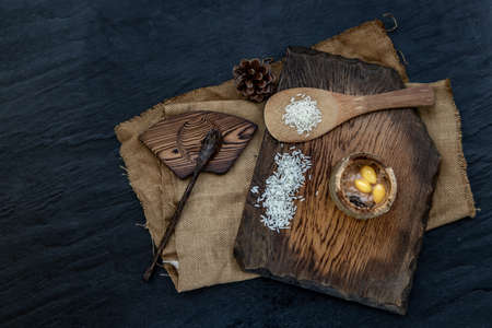 Sticky Rice Cooked with Coconut milk (Khao lam) or Glutinous rice roasted in bamboo joints on wooden, Thai dessert concept, Top view.の写真素材