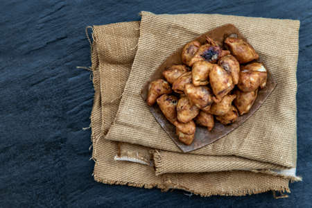 Pansib pastry stuffed on burlap fabric background, Thai style dumplings stuffed, thai dessert, kind of snack, Top view.の写真素材
