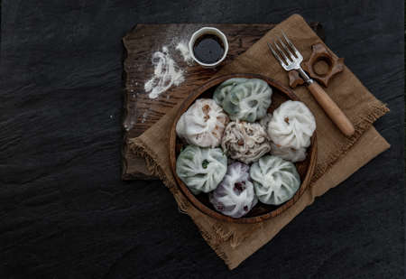 Chinese chives Dumplings Mixed Color or Garlic Chives Dim Sum Rice Cake inside with Taro Slice ,Bamboo shoot and Many kind of vegetable inside the flour, Steamed Served Sweet Black Soy Sauce Chinese Food Style side view, Chinese Food Appetizer dish Style, Top view.の写真素材
