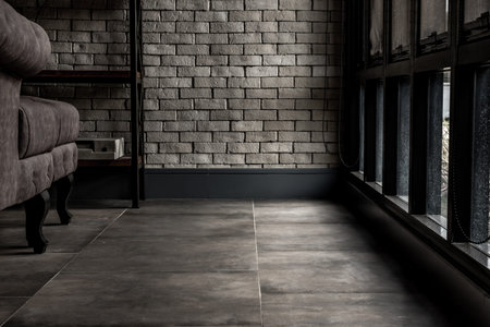 Bangkok, Thailand - 15 Dec 2019 : Minimalist interior of living room with sofa, brick wall and...