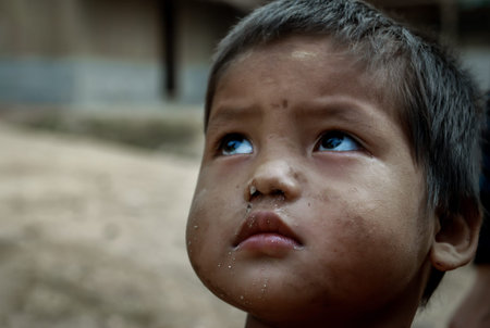 Mae Hong Son, Thailand - Jan 22, 2010 : Refugee people, A refugee little boys in temporary shelter at refugee camp in Thailand, copy space, Selective focus.のeditorial素材