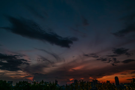 Natural Sunset in evening downtown silhouette at bangkok. Bright Dramatic Sky And Dark Ground. city...
