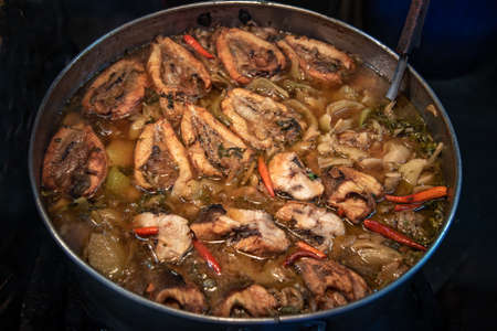 Snake head fish belly with pickle mustard soup. Chinese style. Oblique view from the top, Selective focus.の写真素材