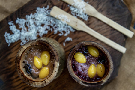 Sticky Rice Cooked with Coconut milk (Khao lam) or Glutinous rice roasted in bamboo joints on...