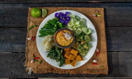 Thai Traditional Local Food : Shrimps chili dip or nam prik with shrimps (Nam Prik Goong Sod) with blanched vegetables and cha-om omelets.の写真素材
