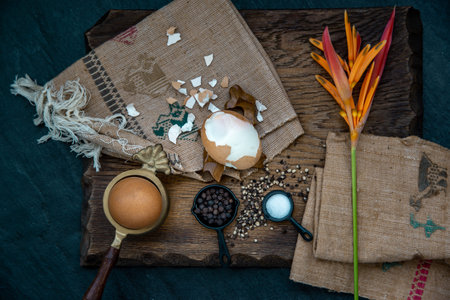 Boiled eggs with salt and pepper on beautiful wooden background, Nutrition concept. The view from...
