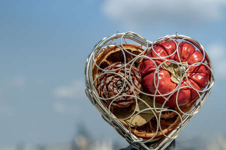 Fruit in the heart gift box with a sky background as a symbol of romance love valentine holiday on Wall background. Miss you concept. Valentine's day background concept. Copy space, Selective focus.の写真素材
