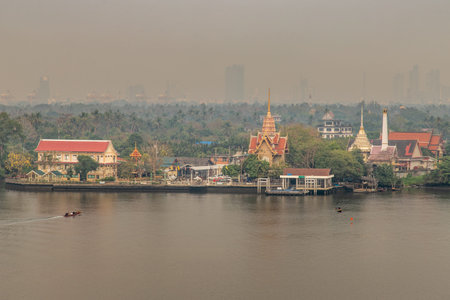 Bangkok,Thailand - Feb 27, 2020 : The view of the Chao Phraya River that sees the green area next to...