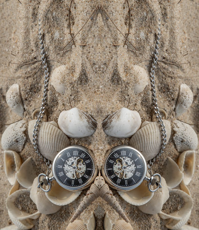 Reflection of Antique pocket watch and shells in sand on the beach and copy space. Time of life in nature concept. Selective focus.の写真素材