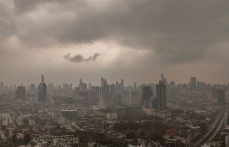 Bangkok, Thailand - 13 Apr, 2019 : Dark clouds before a rain are falling in the city. A large...
