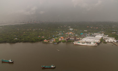 Bangkok, Thailand - Jun 16, 2020 : Aerial view on green area of Bang kachao lung and with Chao...