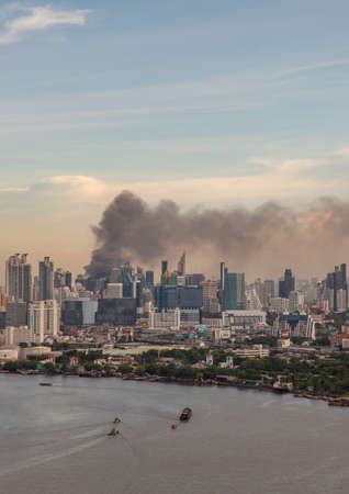 Bangkok, Thailand - Jun 23, 2020 : Aerial photograph of a group of black smoke rising from a fire on a tall building in Bangkok.のeditorial素材