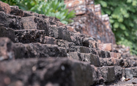 Close-up of Cracked concrete vintage brick wall background. Archaeological area. Pattern on the wall with space for text, No focus, specifically.の写真素材