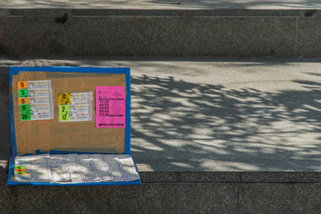 Bangkok, Thailand. Nov - 15, 2020 : Government lottery ticket for sells in panel. Rows of thai lottery have many and different numbers can choosing. Copy space. No focus, specifically.の写真素材