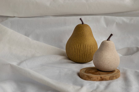 Two beautiful small ceramic vases with wooden logs on white background. Ceramic tableware, Home decor.の写真素材
