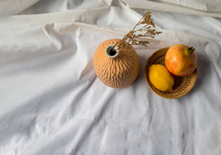 Close-up of Handmade Ceramic Vases and Dried flowers on wooden logs. Home decor, Space for text.の写真素材