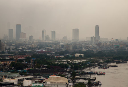 Bangkok, thailand - Dec 23, 2020 : Aerial view of Bangkok city Overlooking Skyscrapers and the Bridge crosses the Chao Phraya river with bright glowing lights at dusk. No focus, specifically.のeditorial素材