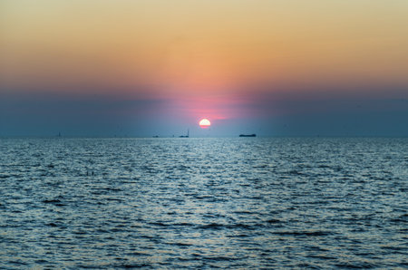 Background of blue and orange sky and empty space for your design. No cloud, No focus, specifically.の写真素材
