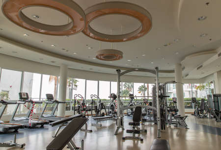 Bangkok, Thailand - Jan 28, 2021 : New normal concept and physical distancing within gym or fitness studio with modern fitness equipment for fitness events and more. Modern of gym interior with equipment. Sports equipment in the gym. Selective focus.の写真素材