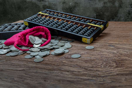 Dried flowers in Two ceramic vase on pink textured table cloth and vintage fan with Old cement wall. Home decor, Selective focus.の写真素材
