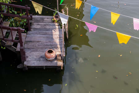 Pork Crackling from lard or Stir-Fried Pork Crackle seasoning with spicy-sweet dipping sauce in ceramic bowl. It is a delicious appetizer. Selective focus.の写真素材