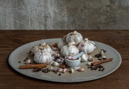 Garlic bulbs and Garlic cloves on Wooden rustic table. Copy space Concept of healthy food. Selective focus.の写真素材