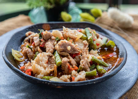 Homemade Sweet Crispy Thai Roti (Thai Pancake) Served with Sweetened condensed milk on ceramic plate. Delicious Thai Dessert, Selective focus.の写真素材