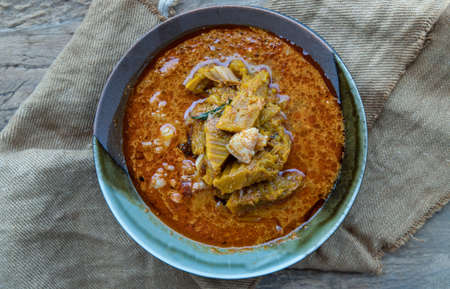 Homemade Sweet Crispy Thai Roti (Thai Pancake) Served with Sweetened condensed milk on ceramic plate. Delicious Thai Dessert, Selective focus.の写真素材