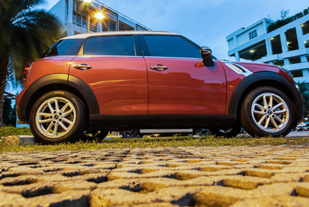 Bangkok, Thailand - 30 Jun 2021 : Side view of Red mini cooper parked in the parking lot. Selective...
