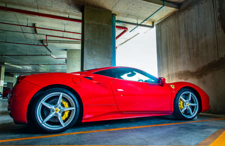 Bangkok, Thailand - 26 Jul 2021 : Side view of Wheel of Black Lamborghini Sports Car parked in the parking lot. Lamborghini is an Italian sports car. Selective focus.のeditorial素材
