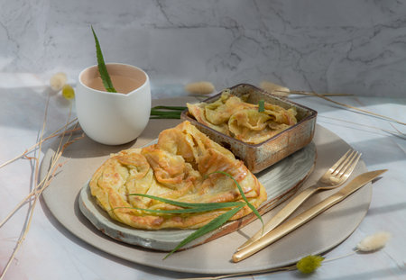 Homemade sweet frying roti (Cannabis Pancake) with Cannabis served with Cannabis tea on ceramic...