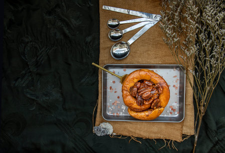 Traditional French sweet dessert : Pecan peanut Brioche on the silver tray. Delicious seasonal...