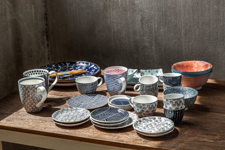 Different Ceramic Plates, Bowl and cup on wooden table. Ceramic tableware, Beautiful arrangement,...