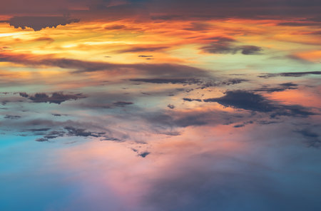 Beautiful sunset sky above clouds with dramatic light, Beautiful blazing sunset landscape, Copy space, Selective focus.の写真素材