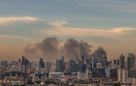 Bangkok, Thailand - Jun 23, 2020 : Aerial photograph of a group of black smoke rising from a fire on a tall building in Bangkok.のeditorial素材