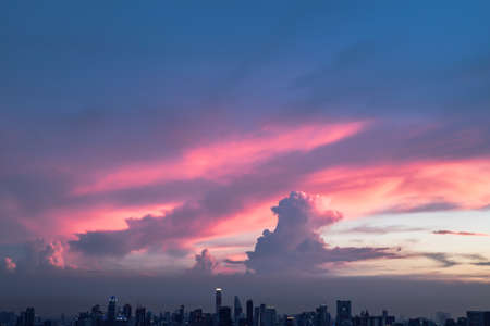 Fantastic colorful sunset sky. Dramatic and wonderful cloud on twilight, Majestic dark blue sky nature background, Colorful cloud on summer season, Copy space, Selective focus.の写真素材