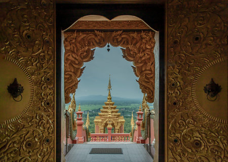 Lampang, Thailand - Sep 04, 2019 : Forest landscape under cloudy blue sky from gate of Wat Phra That Doi Phra Chan in Lampang. A temple on the top of a mountain the north of thailand. Selective focus.のeditorial素材