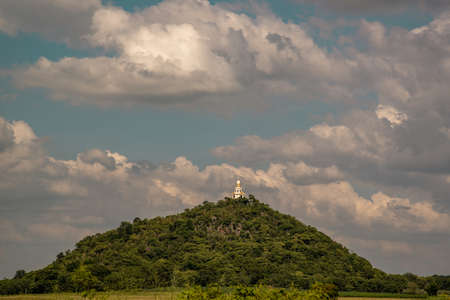 Uthai Thani Province, Thailand Oct 26, 2019 : Wat Tham Khao Prathun that receives on beautiful sun On the top of the hill.のeditorial素材
