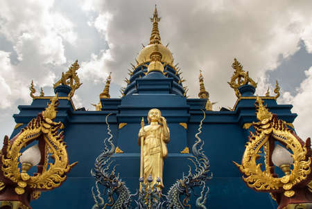 Chiang Rai, Thailand - Sep 05, 2020 : Elaborate sculptures of Golden Buddha image at the famous Wat Rong Suea Ten (Blue Temple) in Chiang rai, Thailand. Selective Focus.の写真素材
