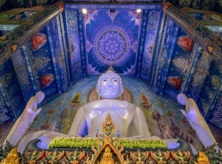 Chiang Rai, Thailand - Sep 05, 2020 : Beautiful Sculpture of white giant Buddha image inside the Buddhist church at Wat Rong Suea Ten Temple, also known as the Blue Temple, locate at Chiang Rai province, northern part of Thailand. Selective Focus.のeditorial素材
