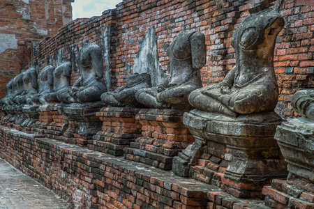 Aytthaya, Thailand, 22 Aug 2020 : Ancient old buddha statue sculpture is damaged at the old temple in Ayuthaya province. thailand, Selective focus.のeditorial素材